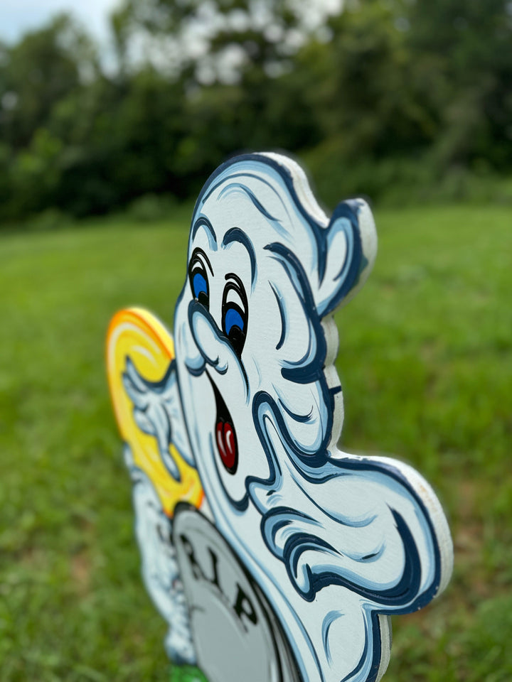 Two Halloween Ghosts Peeking over RIP Tombstone