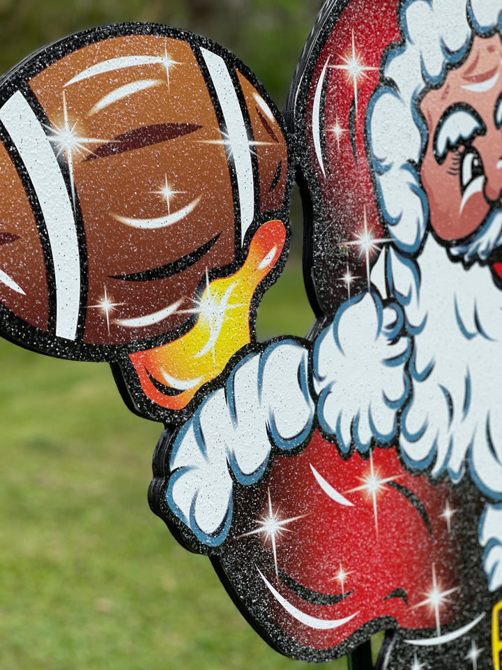 Santa Claus throwing a Football Yard Decoration