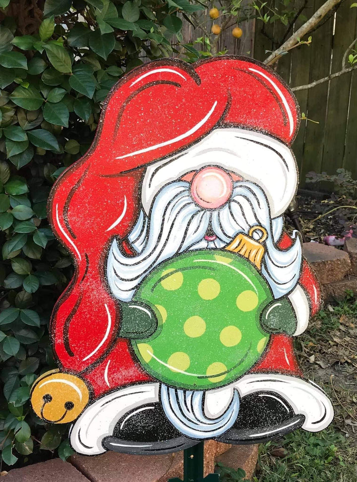 glitter santa gnome holding ornement with plain santa hat painted yard art design