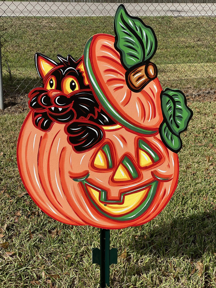 cat coming out of pumpkin painted yard art design