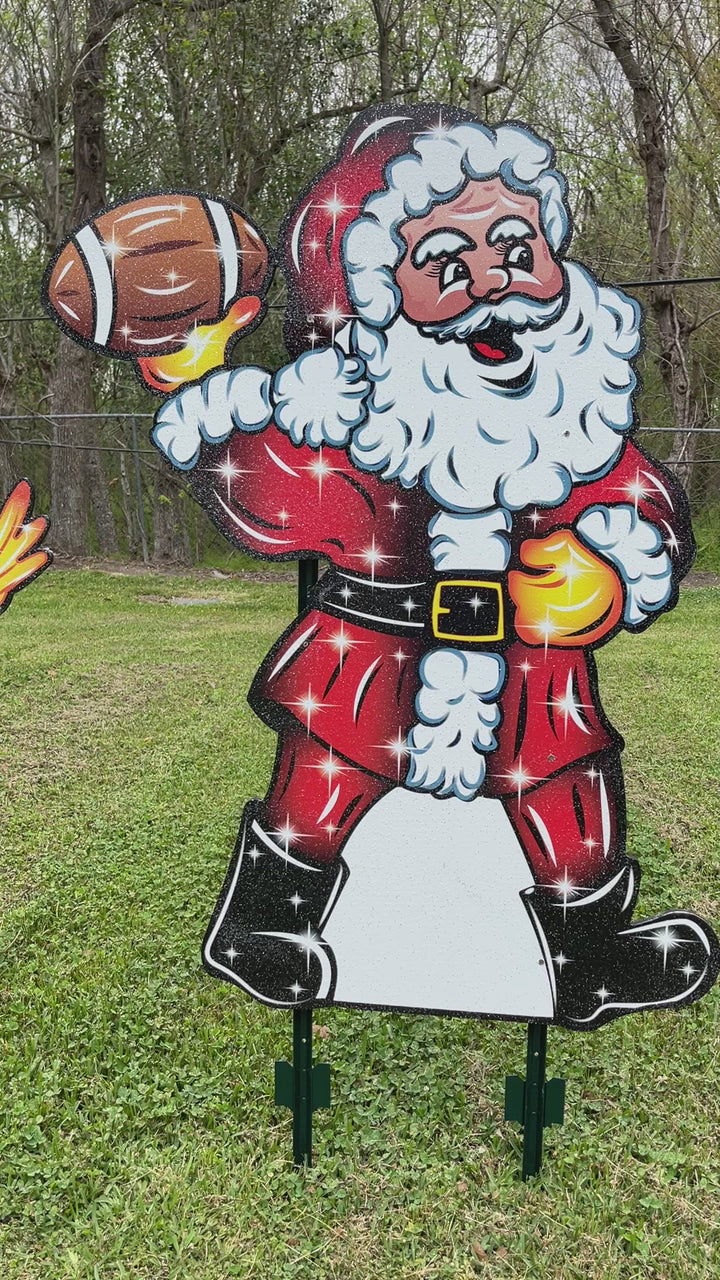 Santa Claus throwing a Football Yard Decoration