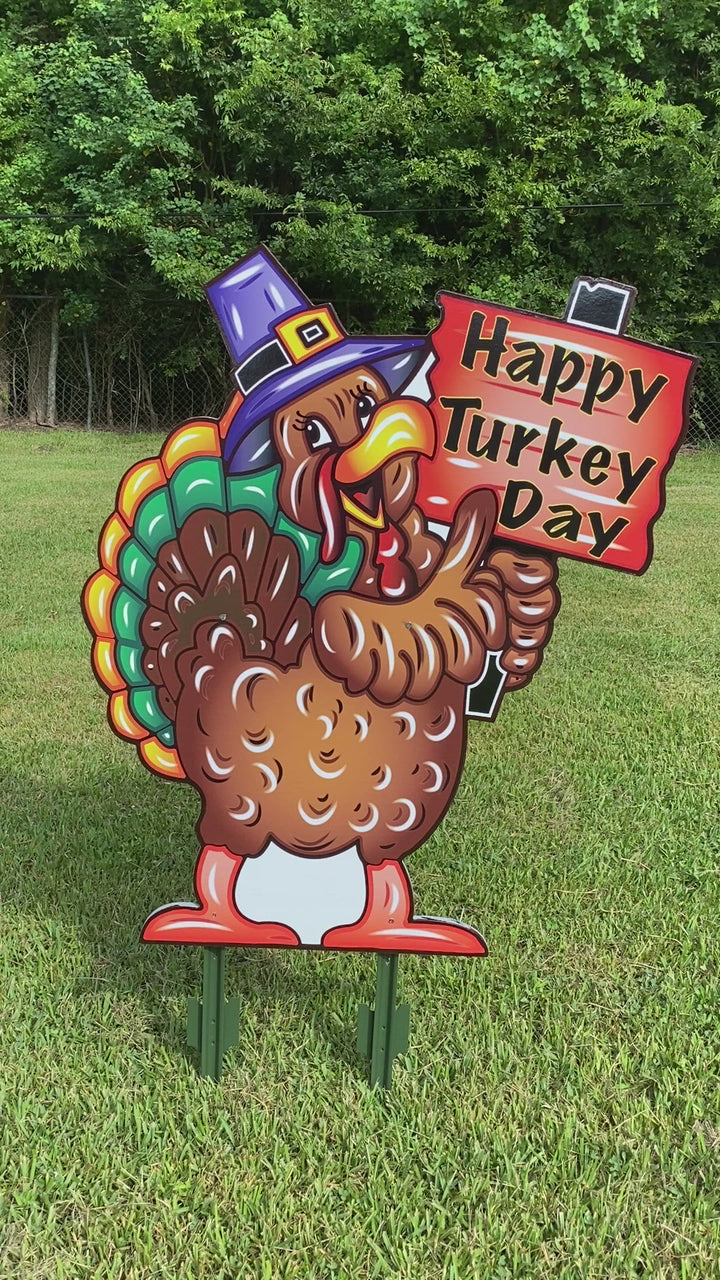 Turkey with Happy Turkey Day Sign