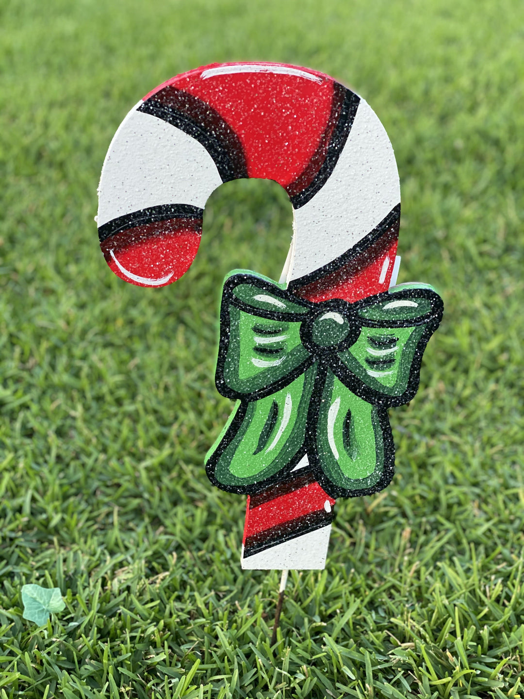 left facing Christmas Candy cane with bow painted yard art design